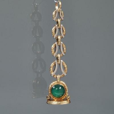 A CHALCEDONY CABOCHON & ENGRAVED 14K GOLD WATCH FOB | Designed as a pair of green chalcedony cabochons (each 11.5 mm diameter),...