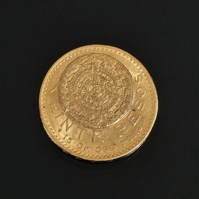 1919 VEINTE PESOS "AZTEC SUNSTONE" MEXICAN GOLD COIN | Decorated with an eagle holding a snake and other Aztec devices, 16.6g -...
