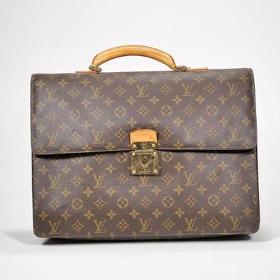 LOUIS VUITTON SOFT BRIEFCASE | Serviette Conseil In the "LV" monogram pattern with brass hardware - l. 15.5 x w. 14 x h. 4 in.

