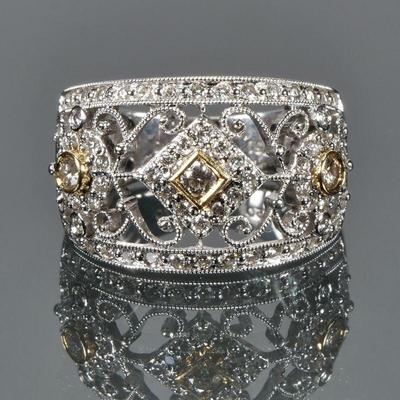 DIAMOND & 18K GOLD FILIGREE RING | Designed as three .15ct diamonds set in yellow gold bezels among and lines of melee diamonds in a...