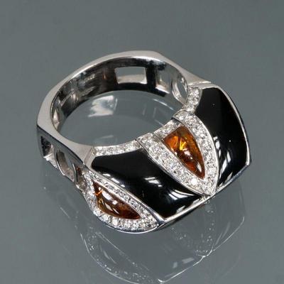 ENAMEL & AMBER 18K GOLD RING | Italian, designed as smoothed teardrop amber alternating with black enamel panels divided by sections...
