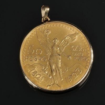 1821-1923 MEXICAN 50 PESO GOLD COIN | 37.5gr ORO PURO, in a (tested to) 14k gold soldered surround with bail; 44.4g total weight - dia....