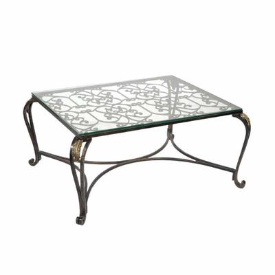 PIERRE DEUX LOW FORM COFFEE TABLE | Metal scrollwork with gilt highlights, glass top - l. 35 x w. 43 x h. 19 in.

