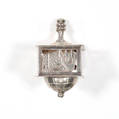 STERLING SILVER DREIDEL | A silver dreidel with openwork sides marked "Israel st 925"; 1.75 in., 0.73 ozt

