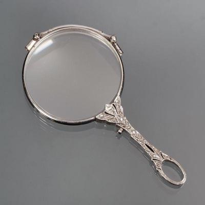 ANTIQUE DIAMOND SET GOLD LORGNETTE | Designed as a 14k white gold lorgnette both sides of the open work handle mounting melee diamonds;...
