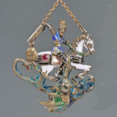 ENAMEL DECORATED ARTICULATING KNIGHT & DRAGON PENDANT | Manner of faberge; designed as an enameled knight on horseback (possibly St....