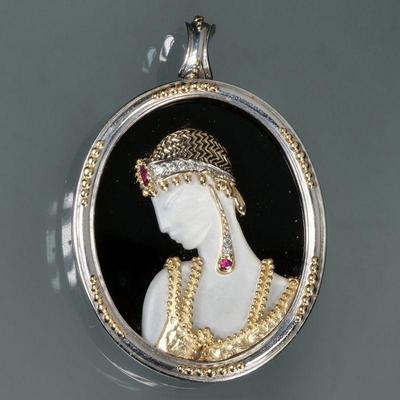 ERTE RUBY, DIAMOND, GOLD & STERLING PIN | Art Deco Salome brooch/pendant designed as a mother of pearl bust adorned in 14k gold...