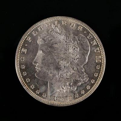 1882-P MORGAN SILVER DOLLAR | In an envelope listing it as "borderline MS 65".

