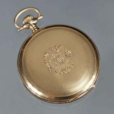 WALTHAM 14K GOLD POCKET WATCH | In an engine turned and monogrammed gold case, having Arabic numerals with a sub-seconds dial, case no....