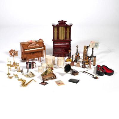DOLLHOUSE MINIATURE INSTRUMENTS | A collection of miniature instruments and music room accessories, including: a Dave Jone piano top,...