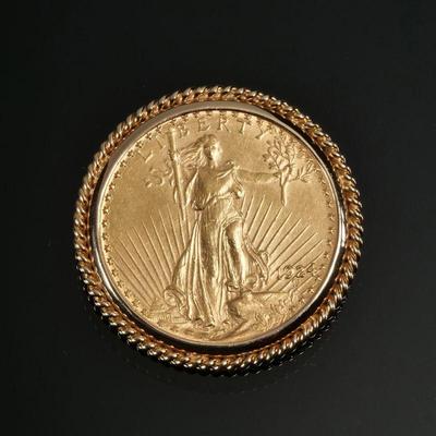 1924 SAINT GAUDENS $20 GOLD DOUBLE EAGLE | In a (tested to) 14k gold soldered twisted rope work surround; 39.8g total weight - dia. 1.5...