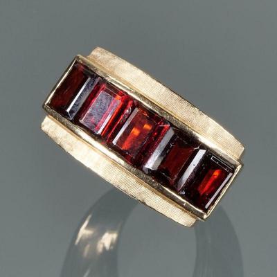 GARNET & 14K GOLD RING | Designed as five nicely matched channel set garnets (6 x 4.75 x 3 mm, each approx.), mounted in a line in a...