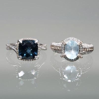 (2pc) FACETED BLUE STONE & 14K GOLD RINGS | Including a ring with central oval modified cut aquamarine or blue quartz surrounded by...