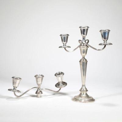NEWPORT STERLING CANDLE HOLDERS | Comprising a single candlestick holder designed in three separate pieces (bottom piece does not secure...
