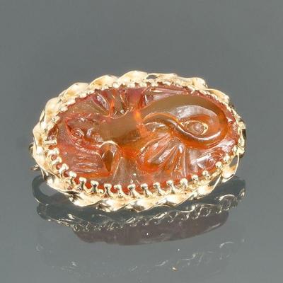 CARVED AMBER & 14K GOLD PIN | Designed as an oval carved Amber pin with a lizard or salamander in high relief in a twisted rope work...