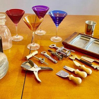 Lot 053-K: It’s 5 o’clock Somewhere

Features: 
•	4 colorful martini glasses, 2 flasks, cocktail plates, cocktail tray, and various...
