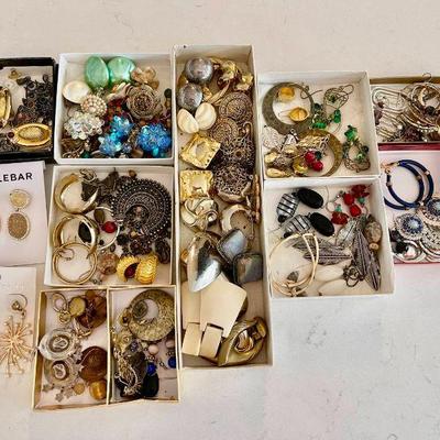 Lot 004-J: Earring Collection

Features: A large collection of costume earrings
•	Some are new in original packaging
•	Some are vintage...