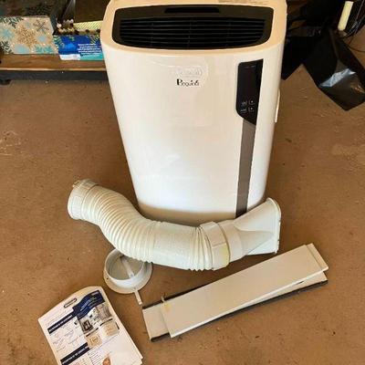 Lot 039-G: DeLonghi Pinguino Portable Room AC

Features: 
•	Model PAC EL275HGRKC-3AL WH
•	Used in Client’s upstairs bonus room
•	White...