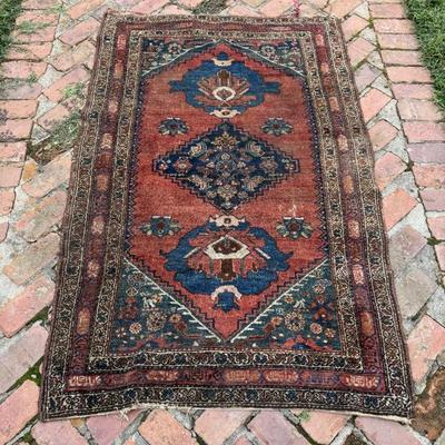 Antique hand knotted wool oriental carpet with geometric design in vivid teal blue. Measures 69” x 43”. 