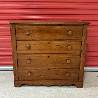 Antique pine chest, well made with four dovetailed drawers. Circa 1800s. Drawers slide well. Handsomely crafted with “heart” trim along...