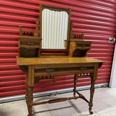 Antique Pine Vanity/Wash Stand with Mirror. Rolls on casters. Well made, featuring handsome woodwork details and three drawers. Measures...