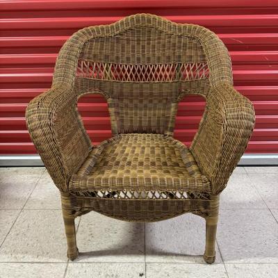 Faux Indoor/Outdoor Wicker Chair. Natural wicker color. Measures 39” wide, 34” tall, 17” seat depth, 15” seat height. $45