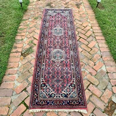 Vintage hand knotted wool oriental carpet runner. Measures 97” x 30”. 