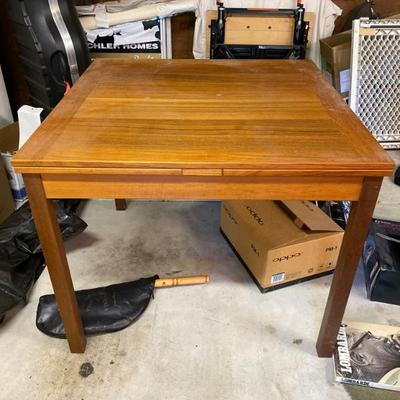 Teak Dining Table with hidden extension leaves