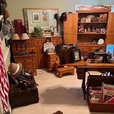 ARMOIRE FILLED WITH SPORTS ITEMS