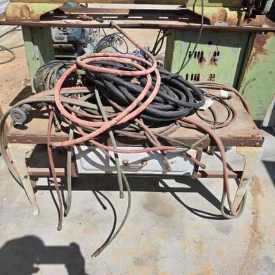 #1040 • Air Hose, Electric Wire, Grinder and Metal Table with Wooden Top
