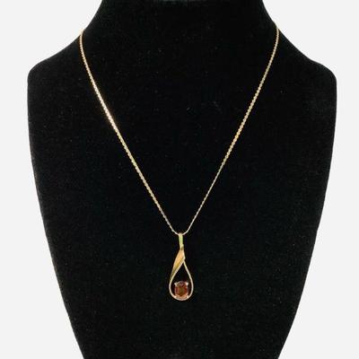 LYZE219 14k Gold Chain With Gold & Garnet Pendant	Stamped 14k by the clasp, with a garnet pendant.
