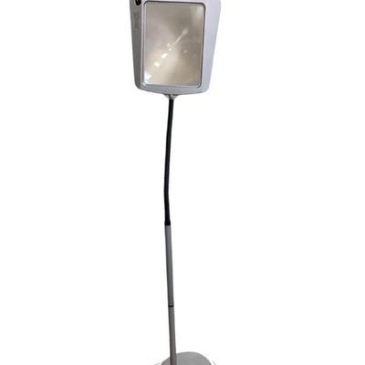 JEHA535 Standing Magnifying Lamp	Silver colored floor magnifying lamp with black flexible goose neck. 
