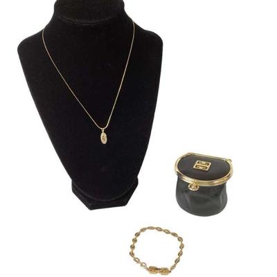 LYZE217 GIVENCHY Leather Pouch, Necklace & Bracelet	Gold tone chain & logo pendant with crystals. Clasp link bracelet

