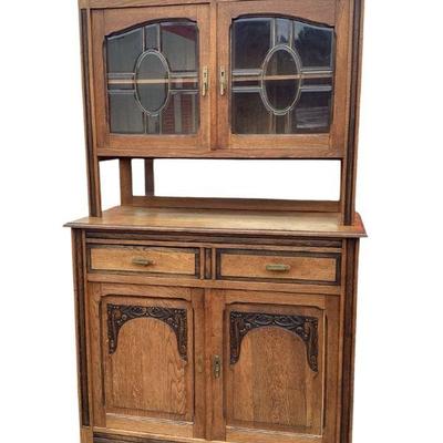 DEJE702 Antique Cabinet	Two piece antique cabinet with beveled glass in doors. Original hardware. Dovetail corners. still has notes from...
