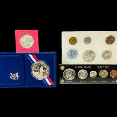 ALSH235 Mixed Coin Sets	-1986 Liberty Silver dollar proof in original government packaging with certification. 
