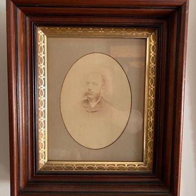 Antique Family Portrait in Ornate Frame
