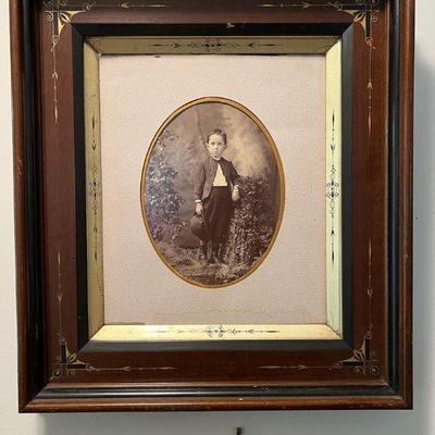 Antique Family Portrait in Ornate Frame
