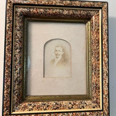 Antique Family Portrait in Ornate Frame
