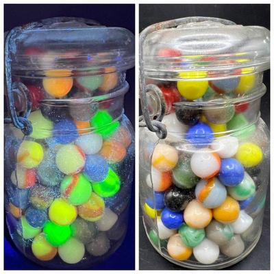 Old Marbles, Many Glowing in Black Light
