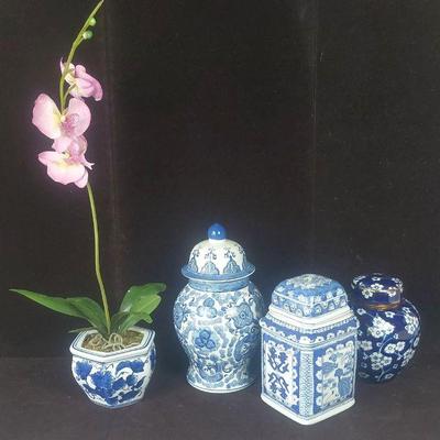 Three Blue And White Jars With One Orchid Vase

