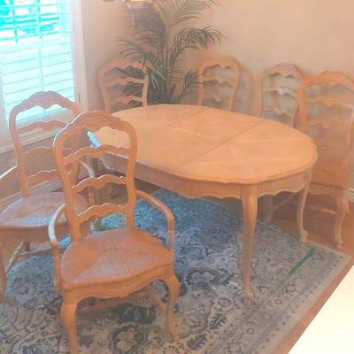 Scalloped Tan Kitchen Table With Six Rattan Seated Chairs