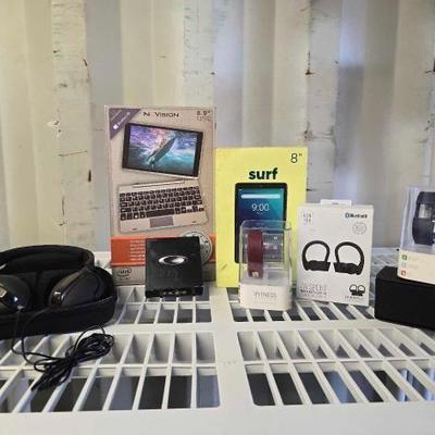 #4054 • Surf Onn Tablet, Gen Tek Bluetooth Headphones, iFitness watch with Bands, Nuvision Keyboard and More