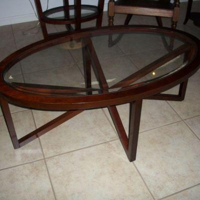 Wood Oval Coffee Table with glass insert.