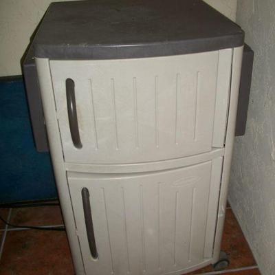 Plastic Garden Cabinet with lift up sides.