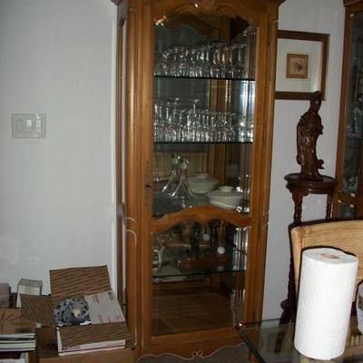 Oak Front open Curio Cabinet with lights ; Stemware.