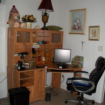 Corner Hutch top Computer Desk ; Serta - Black Desk Chair ; Artwork ; Electronics.