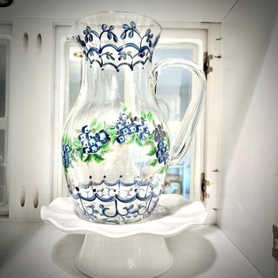 Hand-painted glass pitcher with blueberries on white cake plate
