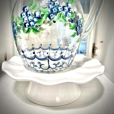 Hand-painted glass pitcher with blueberries on white cake plate