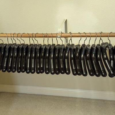 Lot #B69 - 58 Black Plastic Coat Hangers
