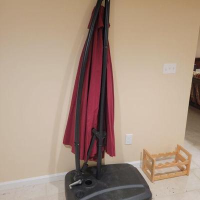 Cantilever patio umbrella with base.
$60